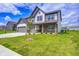 Beautiful two-story home featuring a manicured lawn, brick accents, and a two-car garage at 3148 Hawking Ct, Danville, IN 46122