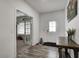 Inviting foyer featuring a wood-look floor, stylish console table, and easy access to additional spaces at 3148 Hawking Ct, Danville, IN 46122