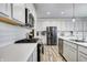 Modern kitchen featuring white cabinets, stainless steel appliances, and bright recessed lighting at 3148 Hawking Ct, Danville, IN 46122