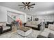 Spacious living room showcasing an open floor plan to the kitchen, hardwood floors, and cozy furnishings at 3148 Hawking Ct, Danville, IN 46122