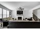 Bright and airy living room with fireplace, large TV, hardwood floors and plush furniture at 3148 Hawking Ct, Danville, IN 46122