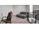 A portion of an expansive main bedroom with tray ceiling, seating, and ample natural light at 3148 Hawking Ct, Danville, IN 46122