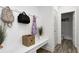 Inviting mudroom boasts built-in bench, coat hooks, and storage, perfect for organized entry and exit at 3148 Hawking Ct, Danville, IN 46122
