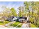 An aerial view showcasing the cozy home with mature trees and a well-manicured lawn at 3322 W 22Nd St, Indianapolis, IN 46222