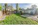 Backyard featuring a grassy area with a wooden fence and a small storage shed at 3322 W 22Nd St, Indianapolis, IN 46222