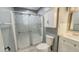 Updated bathroom with a glass shower, vanity with storage, and modern fixtures at 3322 W 22Nd St, Indianapolis, IN 46222
