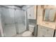 Bathroom featuring a glass shower, vanity, and stylish decor at 3322 W 22Nd St, Indianapolis, IN 46222