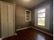 Bedroom featuring hardwood floors, a closet, a built-in shelf, and natural light at 3541 Orchard Ave, Indianapolis, IN 46218