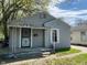 Charming home featuring gray siding, covered front porch, and well-maintained yard at 3541 Orchard Ave, Indianapolis, IN 46218