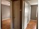 Hallway view into rooms with hardwood floors at 3541 Orchard Ave, Indianapolis, IN 46218