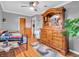 Spacious bedroom with hardwood floors, large dresser with mirror, and a ceiling fan provides comfort and ample storage at 389 E State Road 42, Mooresville, IN 46158