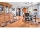 Open-concept dining room featuring hardwood floors, a hutch, table, and natural light at 389 E State Road 42, Mooresville, IN 46158