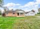 Charming ranch-style home featuring a mix of brick and white siding and a cozy front porch at 389 E State Road 42, Mooresville, IN 46158