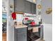 This lovely kitchen features gray cabinets, stainless steel appliances, and view to an adjacent dining area at 389 E State Road 42, Mooresville, IN 46158