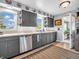 This lovely kitchen features gray cabinets, stainless steel appliances, and access to an adjacent room at 389 E State Road 42, Mooresville, IN 46158