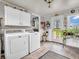 Bright laundry room features modern washer, dryer and natural light at 389 E State Road 42, Mooresville, IN 46158