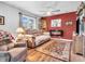Cozy living room features a fireplace, large windows, and a comfortable sofa, perfect for relaxing at 389 E State Road 42, Mooresville, IN 46158