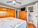 Bedroom featuring wood floors, and a view into an en suite bathroom creates an inviting and functional space at 389 E State Road 42, Mooresville, IN 46158