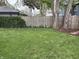 Backyard features mature trees, a wooden fence, and a well-manicured lawn at 421 W 44Th St, Indianapolis, IN 46208
