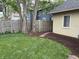 Backyard includes trees providing shade, a grassy area, and stepping stone pathway at 421 W 44Th St, Indianapolis, IN 46208