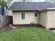 Backyard featuring a well-maintained lawn and a charming stepping stone path at 421 W 44Th St, Indianapolis, IN 46208