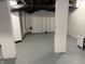 Spacious basement with painted floor, walls and exposed utilities at 421 W 44Th St, Indianapolis, IN 46208