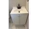 Bathroom vanity with a modern black faucet, white sink, and a two-door cabinet at 421 W 44Th St, Indianapolis, IN 46208