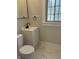 Bathroom with updated marble floors, fixtures, and window at 421 W 44Th St, Indianapolis, IN 46208