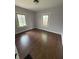 Bedroom with hardwood floors and natural light from the two windows at 421 W 44Th St, Indianapolis, IN 46208