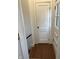 Hallway showing door and hardwood floors at 421 W 44Th St, Indianapolis, IN 46208