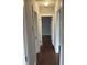 Hallway with hardwood floors and fresh paint, showcasing the bright and airy atmosphere at 421 W 44Th St, Indianapolis, IN 46208