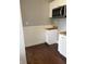 View of renovated kitchen area with microwave and butcher block countertops at 421 W 44Th St, Indianapolis, IN 46208