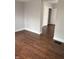 Open-concept living area featuring hardwood floors and fresh paint at 421 W 44Th St, Indianapolis, IN 46208