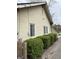 Home's exterior showcasing meticulously trimmed shrubs enhancing the curb appeal and adding greenery at 421 W 44Th St, Indianapolis, IN 46208