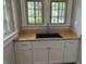 Modern sink with stainless steel faucet and butcher block countertop at 421 W 44Th St, Indianapolis, IN 46208