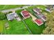 Expansive aerial view of a charming two-story home with lush green lawns and inviting curb appeal at 429 E Main St, Whiteland, IN 46184