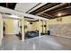 Spacious basement area with finished floors, exposed ceiling, and workout equipment at 429 E Main St, Whiteland, IN 46184
