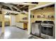 Basement laundry area with modern appliances and storage shelving at 429 E Main St, Whiteland, IN 46184