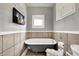 Charming bathroom featuring a classic clawfoot tub, tiled walls, and vintage-style decor at 429 E Main St, Whiteland, IN 46184