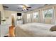 Comfortable bedroom features hardwood floors, ample natural light, and a view, creating a relaxing and inviting space at 429 E Main St, Whiteland, IN 46184