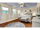 Bright and airy bedroom with ample natural light, a comfortable queen bed, and stylish accents, creating a relaxing retreat at 429 E Main St, Whiteland, IN 46184