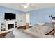 Comfortable bedroom featuring hardwood floors, ceiling fan, and ample natural light at 429 E Main St, Whiteland, IN 46184