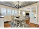 Cozy dining room with chandelier, hardwood floors, and plenty of natural light at 429 E Main St, Whiteland, IN 46184