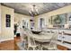 Bright dining room with a large farmhouse-style table, modern decor and view into other living spaces at 429 E Main St, Whiteland, IN 46184