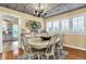 Charming dining room with a farmhouse-style table, chandelier, and ample natural light at 429 E Main St, Whiteland, IN 46184