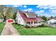Charming two-story home with a detached garage and well-manicured landscaping at 429 E Main St, Whiteland, IN 46184
