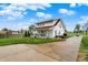 Charming two-story home with a covered front porch and a long driveway at 429 E Main St, Whiteland, IN 46184