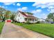 Charming two-story home with new roof, front porch, long driveway, and detached two car garage at 429 E Main St, Whiteland, IN 46184