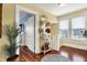 Bright and spacious hallway with natural light, a decorative mirror, and elegant decor, creating an inviting entrance at 429 E Main St, Whiteland, IN 46184