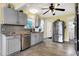 Well-maintained kitchen with modern stainless steel appliances, ample counter space, and stylish grey cabinetry at 429 E Main St, Whiteland, IN 46184